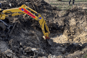 HE machine digging - V2 Rocket Excavation